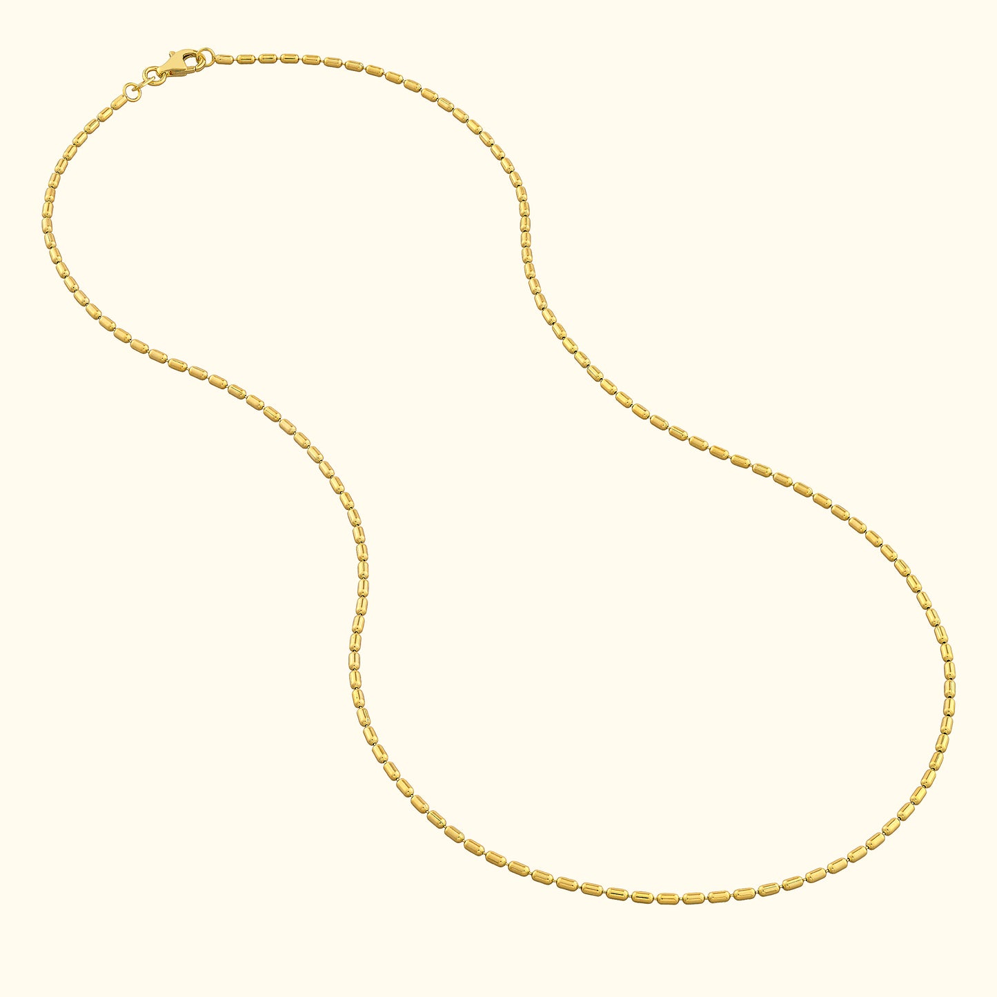 Delicate gold chain necklace with an alternating oval and round link design.