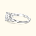 Elegant silver ring featuring a large, intricate diamond setting.