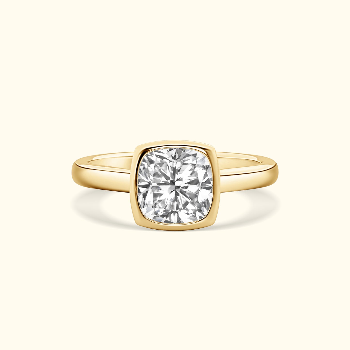 Gold ring with a large, round, sparkling diamond in a cushion setting.