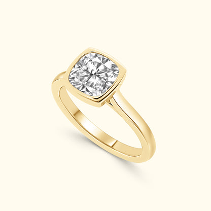 Gold ring featuring a large square-cut diamond set in a sleek band.