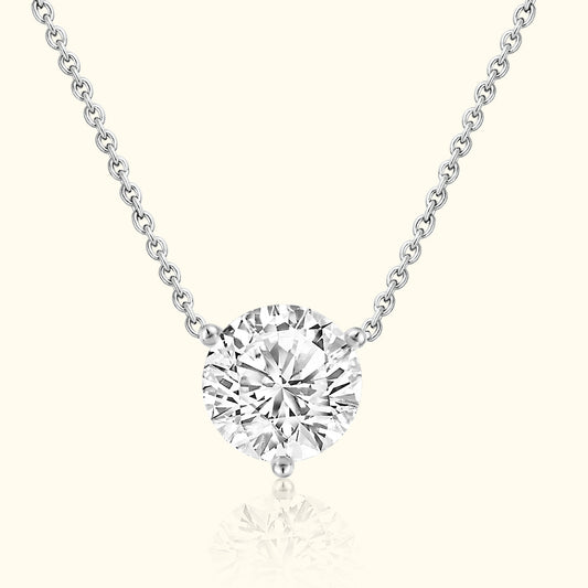 Silver chain necklace featuring a large, round, sparkling diamond pendant.