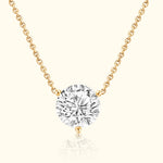 Gold chain necklace featuring a large, sparkling round diamond pendant.