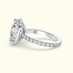 Elegant silver engagement ring featuring a large center diamond and smaller diamonds on the band.