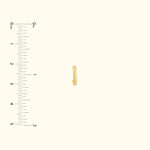 Small, simple gold hoop earring displayed next to a ruler for size comparison.