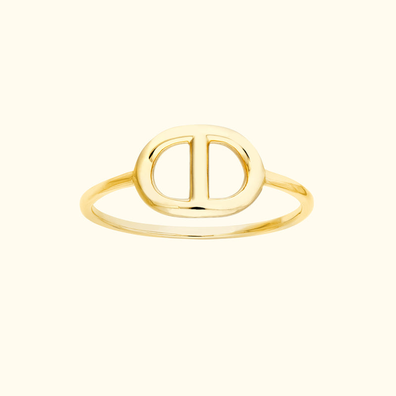 Gold ring featuring an embossed double "D" design in the center.