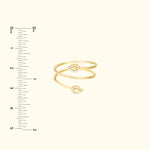 Gold double band ring featuring two teardrop designs, each adorned with small stones.