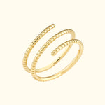 Stylish gold spiral ring with alternating smooth and textured bands.