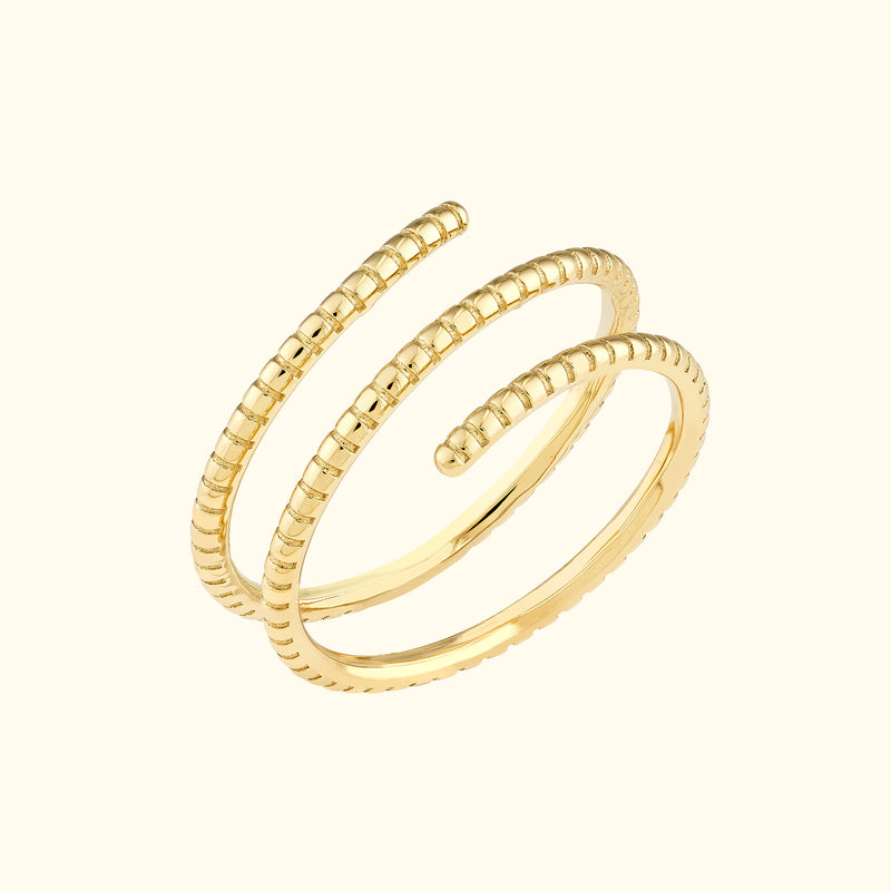 Stylish gold spiral ring with alternating smooth and textured bands.