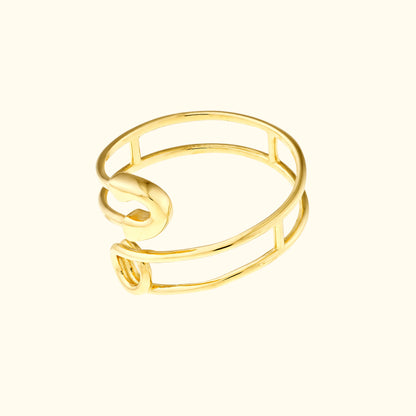 Open gold cuff bracelet with a minimalist design.