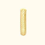 Golden braided ring with a textured surface, reflecting light elegantly.