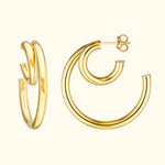 Sleek gold hoop earrings with a modern, twisted design.