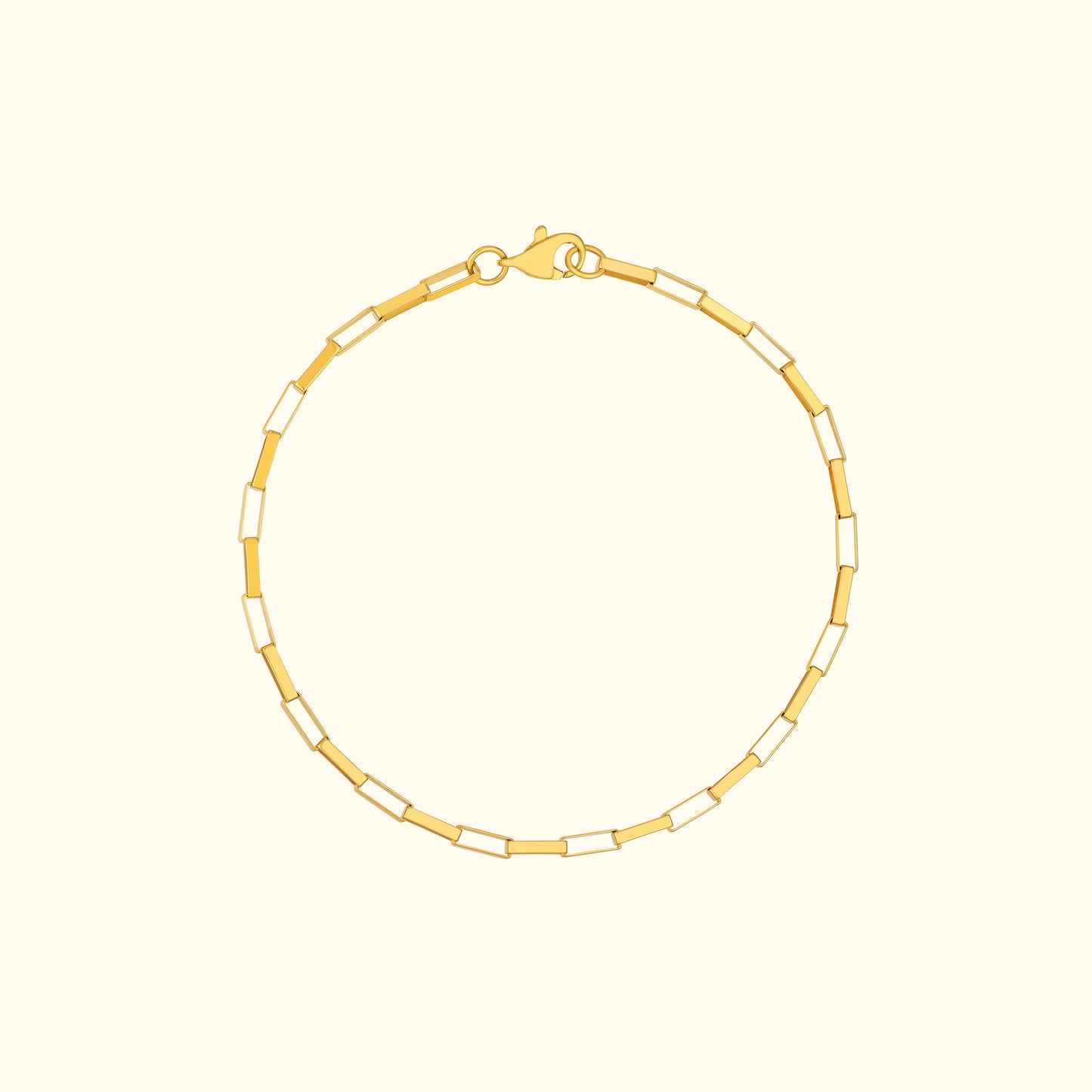 Gold chain bracelet with alternating rectangular links and a lobster clasp.