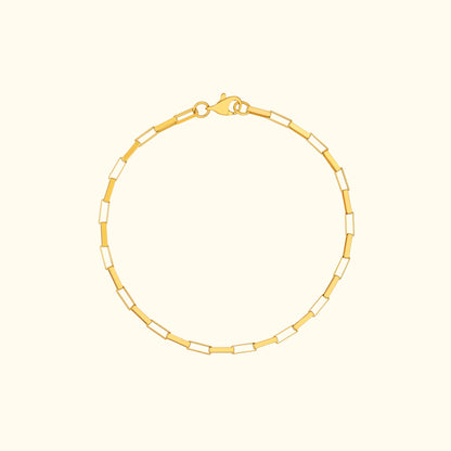 Gold chain bracelet with alternating rectangular links and a lobster clasp.