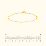 Gold chain bracelet with rectangular links and a lobster clasp.