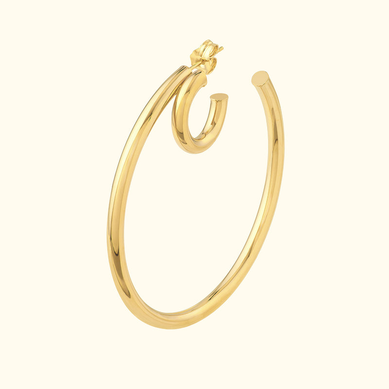 Sleek, gold hoop earring with a unique spiral design.
