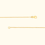 A delicate gold chain with a lobster clasp and a circular loop at the end.