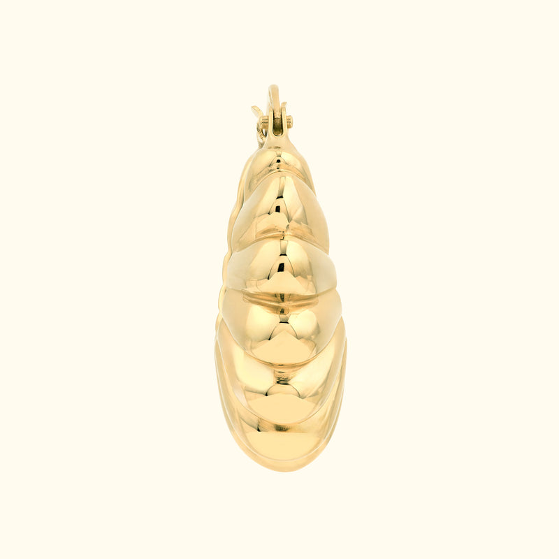 Gold earring with a smooth, spiraling design.