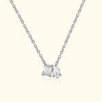 Silver necklace featuring two distinct diamond charms.