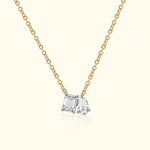 Gold chain necklace featuring two sparkling diamond charms.