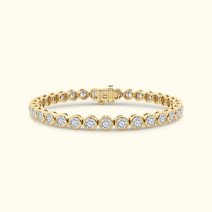 Gold tennis bracelet featuring round diamonds set in a sleek prong setting.