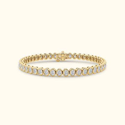 Elegant gold bracelet with round diamonds set in a delicate line pattern.