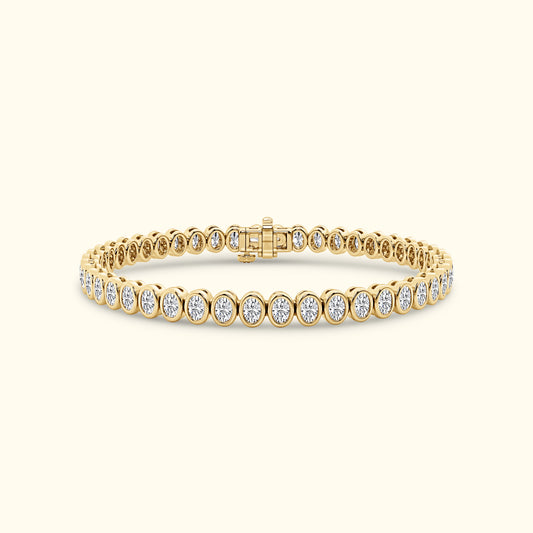 Elegant gold bracelet with round diamonds set in a delicate line pattern.