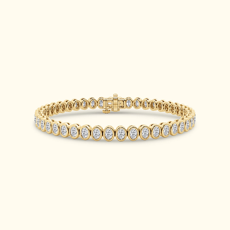 Elegant gold bracelet with round diamonds set in a delicate line pattern.