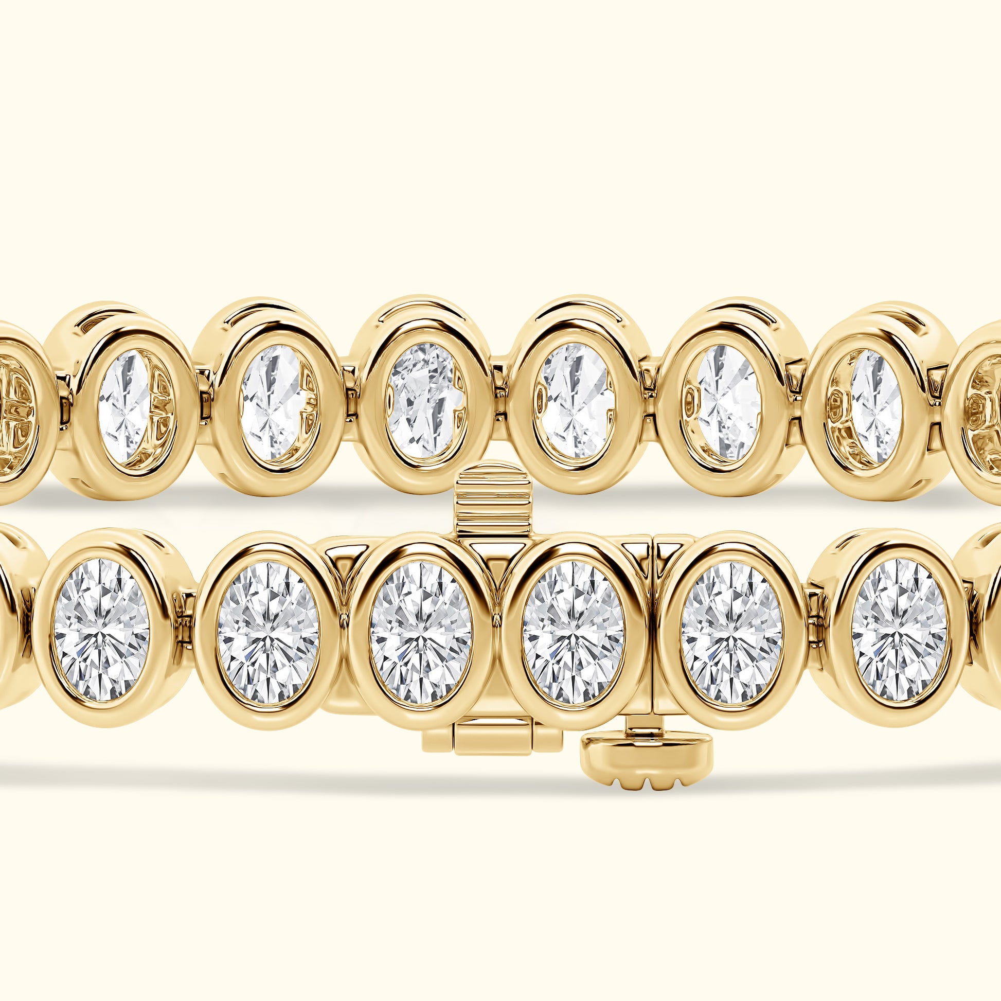 Gold bracelet with alternating oval and round diamonds, showcasing a sparkling design.