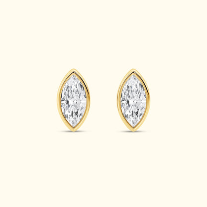 Marquise-cut diamond stud earrings set in yellow gold.