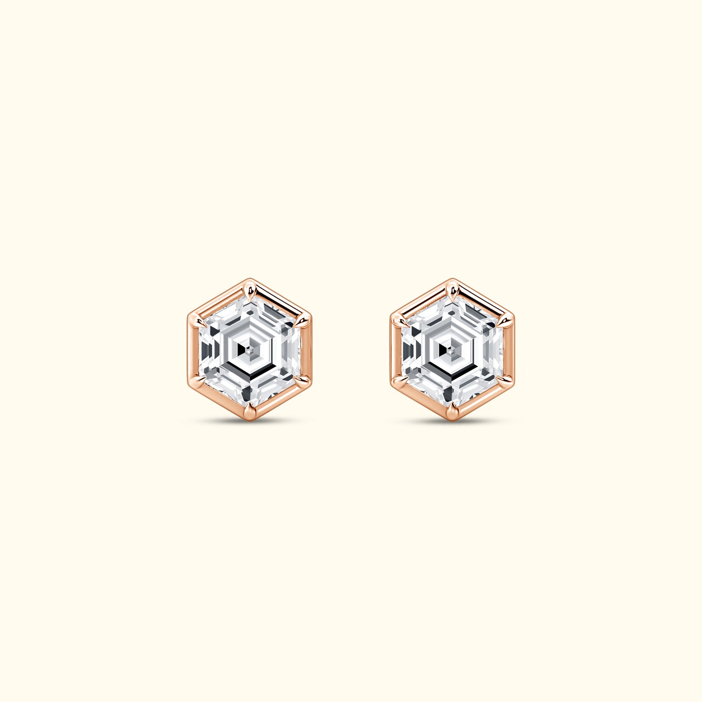 Hexagonal stud earrings featuring clear gemstones set in rose gold frames.