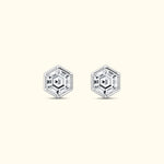 Hexagonal crystal earrings with a clear, geometric design on a light background.