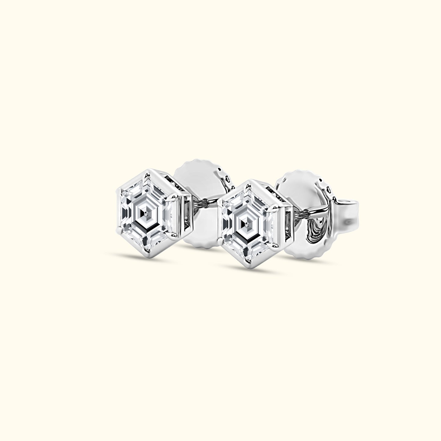 Elegant silver hexagonal cufflinks with clear gemstones, set against a light background.