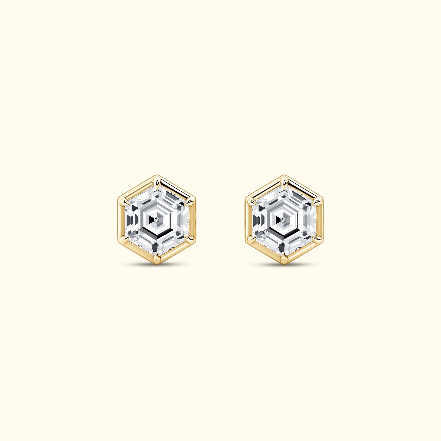 Hexagonal gold and silver earrings featuring sparkling clear gemstones.