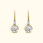 Gold hexagonal drop earrings with clear gemstones, featuring elegant detailing.