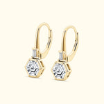 Gold hexagonal earrings with clear stones and a sleek design.