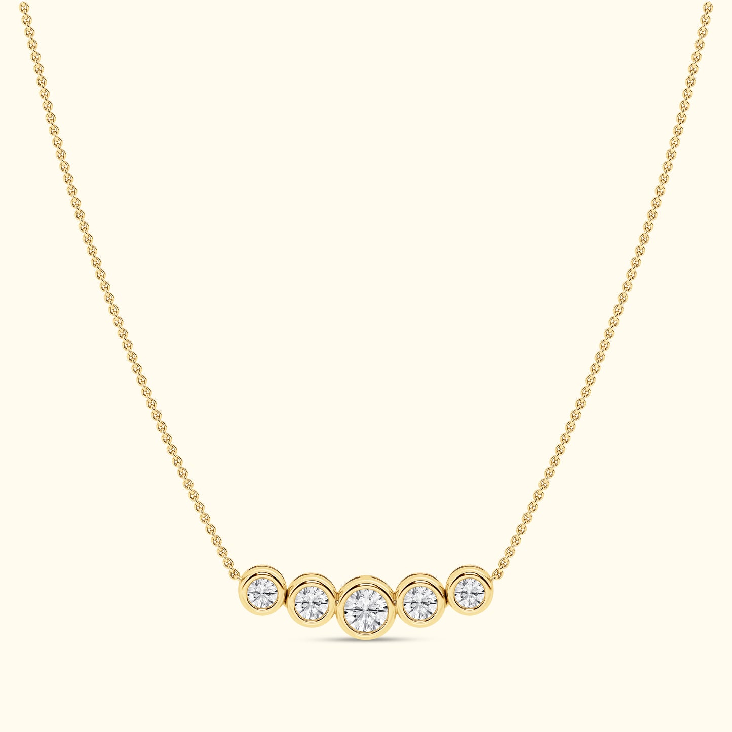 Gold necklace featuring five round diamonds arranged in a horizontal line.