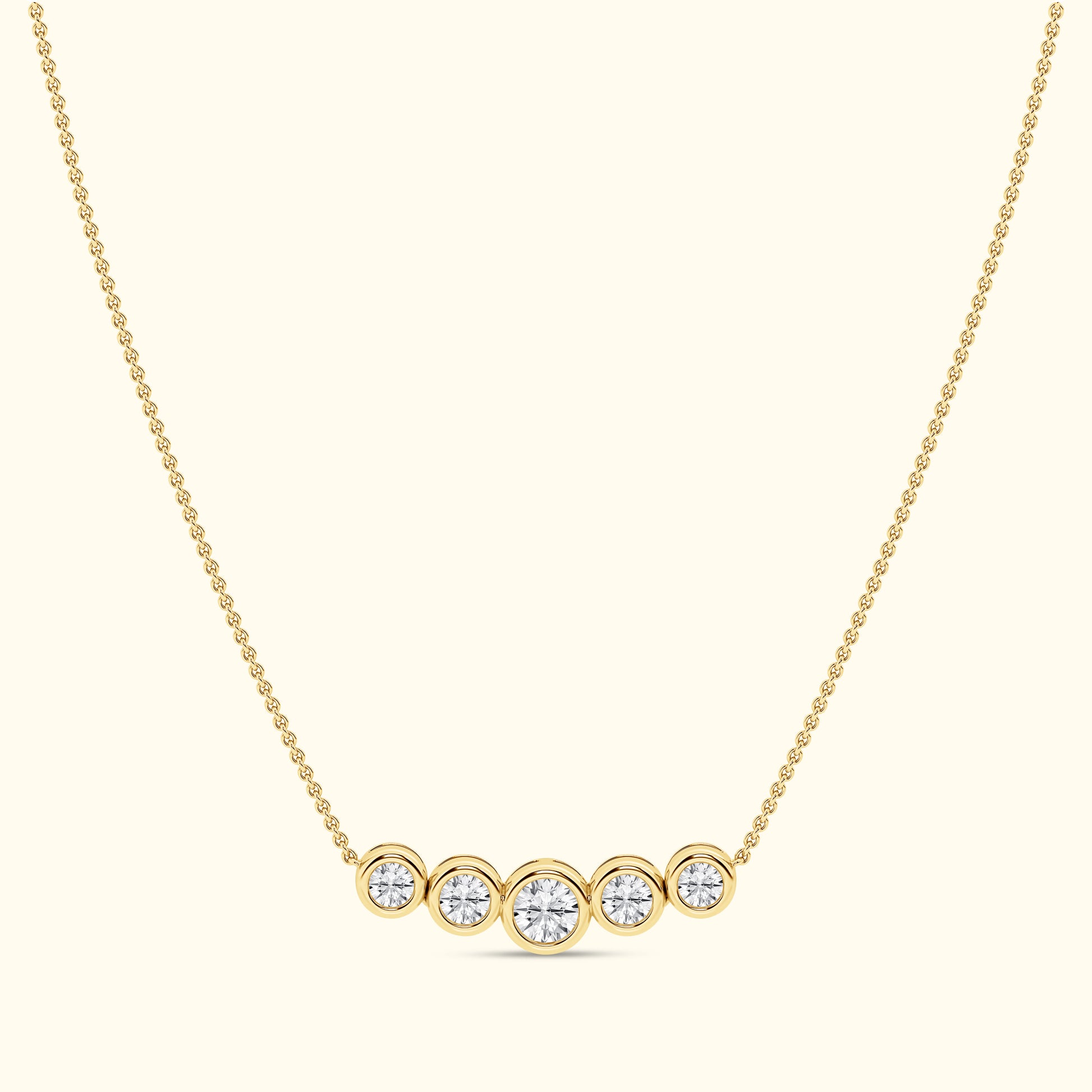 Gold necklace featuring five round diamonds arranged in a horizontal line.