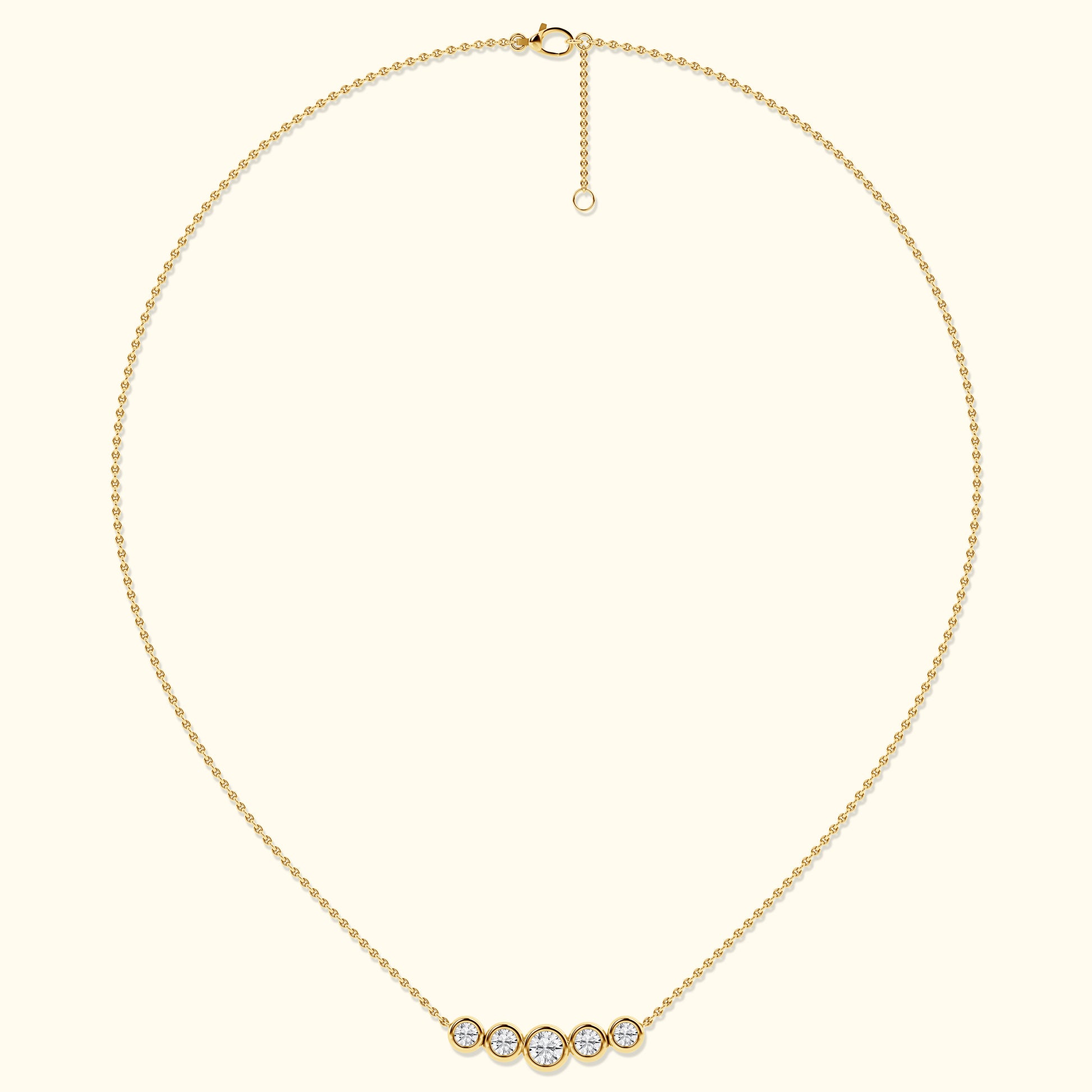 Delicate gold necklace with five sparkling diamonds in circular settings.