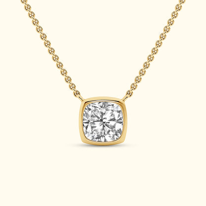 A gold necklace featuring a square-cut diamond pendant on a delicate chain.