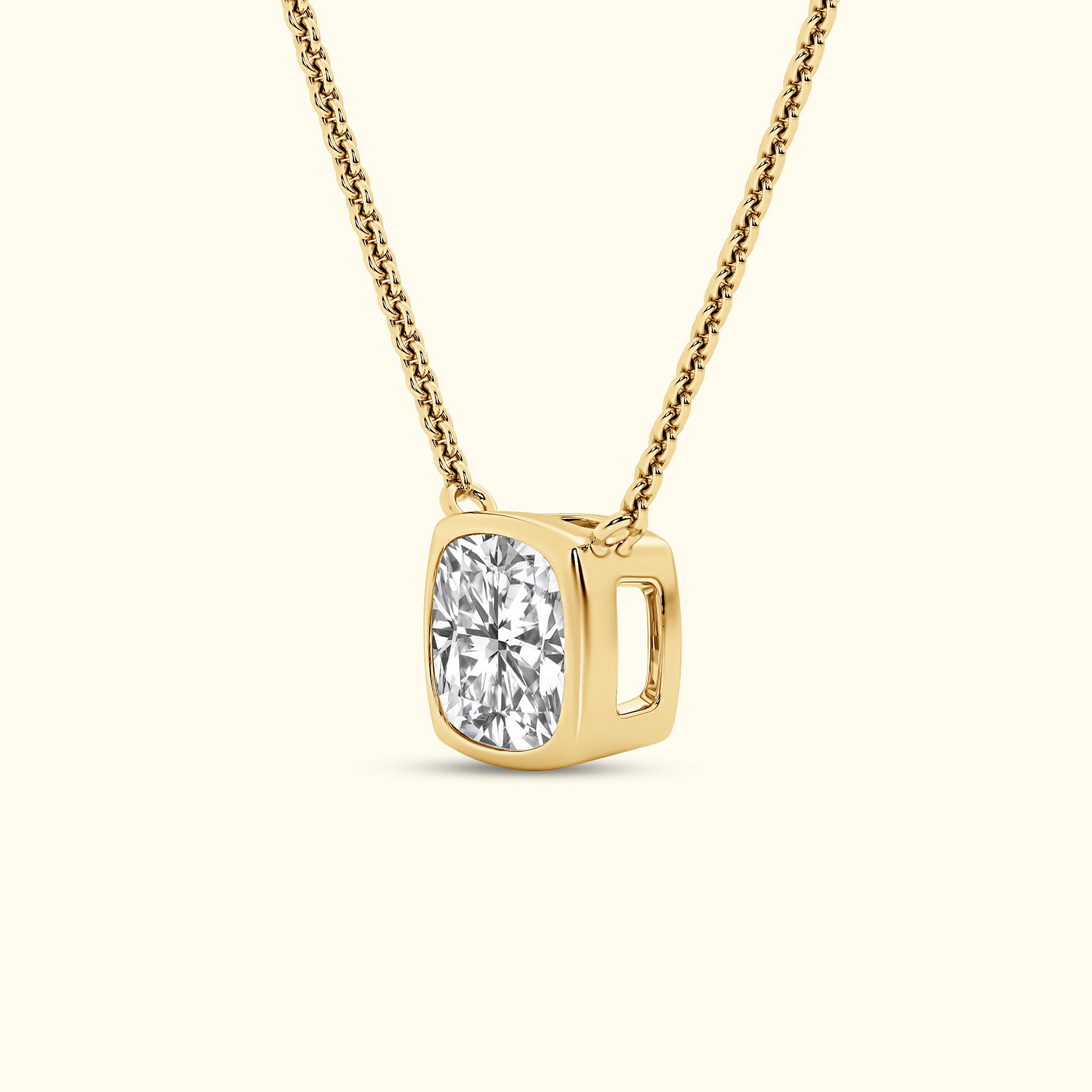 Gold necklace featuring a square-shaped pendant with a sparkling round diamond.