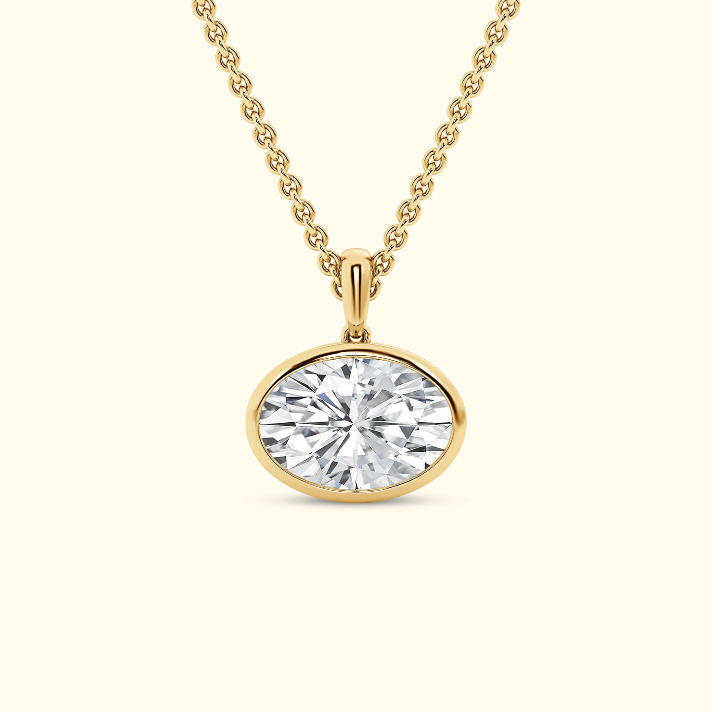 Gold necklace with an oval diamond pendant.