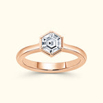 Rose gold ring featuring a hexagonal diamond centerpiece.