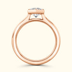 Rose gold engagement ring featuring a sparkling diamond at the center.