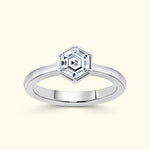 Elegant silver ring featuring a hexagonal diamond centerpiece.