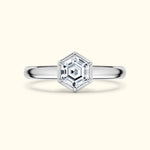 Hexagon-shaped diamond engagement ring on a polished silver band.