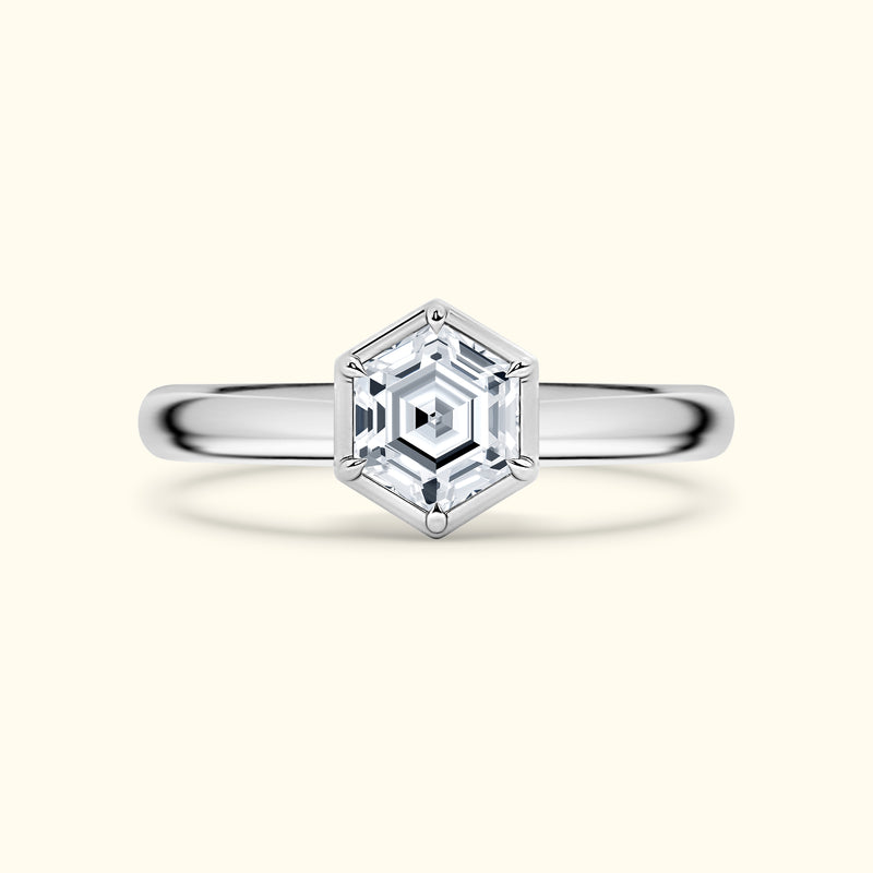 Hexagon-shaped diamond engagement ring on a polished silver band.
