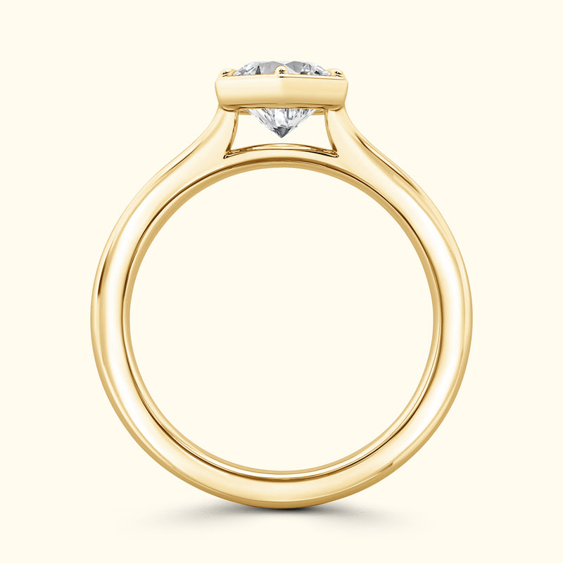 Elegant yellow gold engagement ring featuring a prominent diamond on a sleek band.