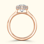 Rose gold ring with a large heart-shaped diamond and small accent diamonds.