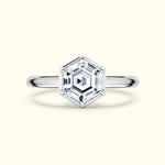 Hexagon-shaped diamond ring with a sleek silver band.