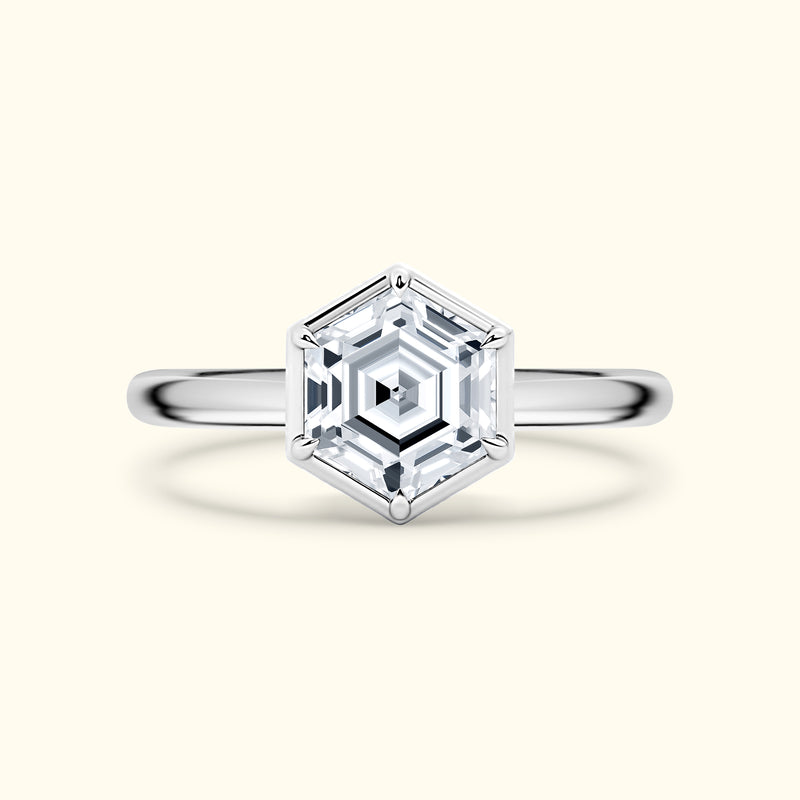 Hexagon-shaped diamond ring with a sleek silver band.